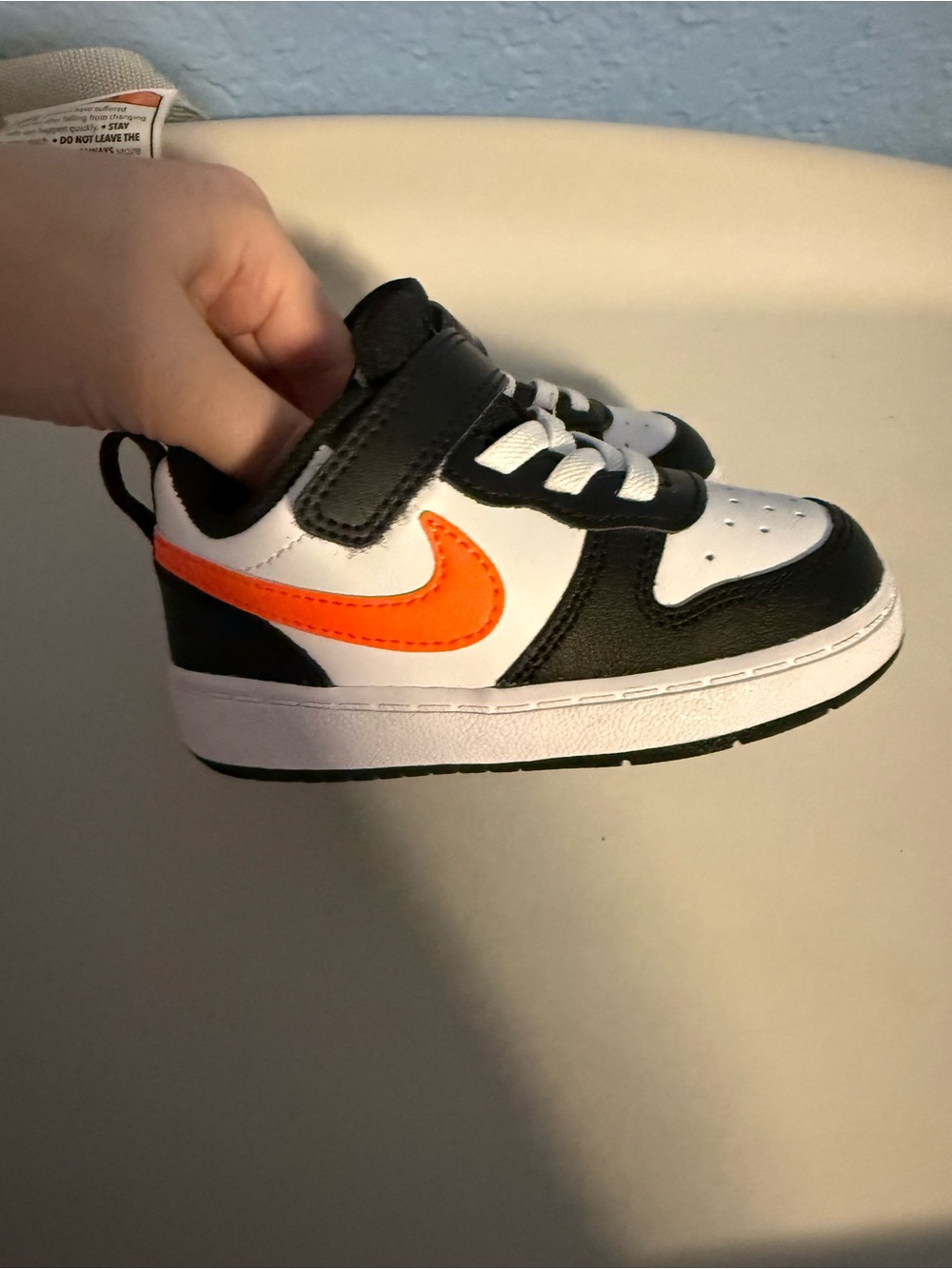 Nike Kids Black White Sneakers with Orange Swoosh